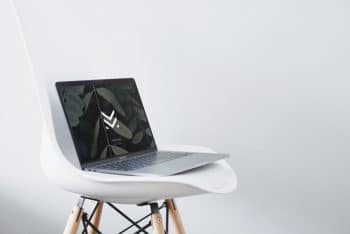 Free MacBook Plus Chair Scene Mockup in PSD