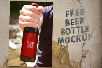 Free Hand Holding Beer Bottle Mockup in PSD