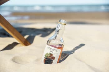 Free Alcoholic Drink Plus Sand Mockup in PSD