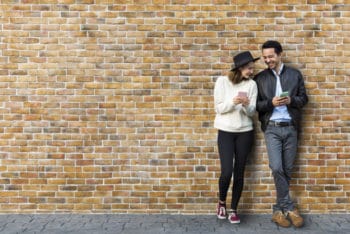 Free Dating Couple Plus Brick Wall Scene Mockup in PSD
