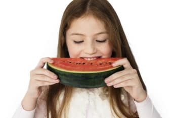 Free Girl Eating Watermelon Mockup in PSD