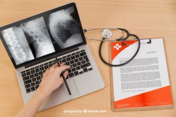 Free Medical MacBook Plus Stethoscope Mockup in PSD