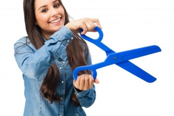 Free Woman Holding Large Scissors Mockup in PSD